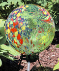 Green Artistic Glass Gazing Ball Globe Set Of Two, 10 Inch Garden Decor Orb with colorful patterns on stand in yard