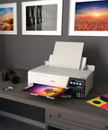 EcoTank Photo ET-8550 Wireless Wide-Format All-In-One Supertank Printer on desk, printing a photo, with 4.3-Inch Color Touchscreen
