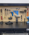 100 Piece Metal Pegboard Hooks And Accessories Set For One Eighth And One Quarter Inch Peg Boards organizing tools on a black workbench.