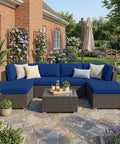 Patio with rattan furniture featuring Waterproof Outdoor Cushion Covers For Patio Furniture, 8 Piece Navy Solid Stretch Slipcovers.