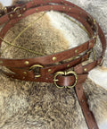 Snag This Fresh Medieval Faux Leather Wrap Belt To Kick Up Your Vintage Look With Adjustable Chain Details And A Snug Custom Fit That Elevates Your Everyday Streetwear Game Instantly on a textured fur background.