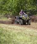 Man using Beefy 28 Inch ATV UTV Disc Plow Harrow With Universal 2 Inch Receiver Mount Delivers Deep Tillage Tight Turning And Efficient Cultivation For 1 To 2 Acres On Farms Trails And Fields on field