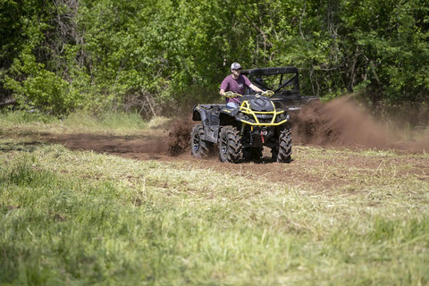 Man using Beefy 28 Inch ATV UTV Disc Plow Harrow With Universal 2 Inch Receiver Mount Delivers Deep Tillage Tight Turning And Efficient Cultivation For 1 To 2 Acres On Farms Trails And Fields on field
