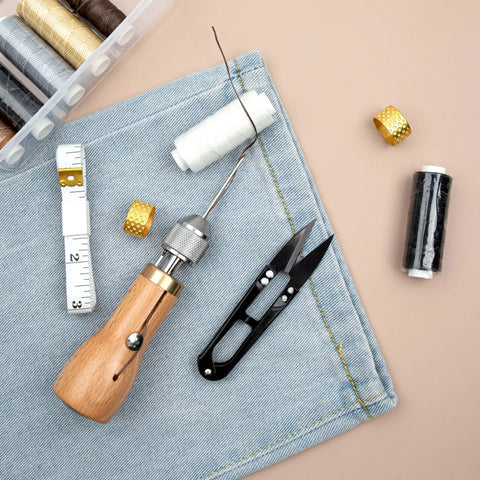 Handy Sewing Awl Kit For Leather Stitching, Portable All-In-One Tool Set with accessories on denim fabric background