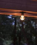 Backyard Bistro Style 24 Foot Outdoor String Lights With 12 Shatter Resistant Lifetime Bulbs, 2200K Warm White glowing outdoors