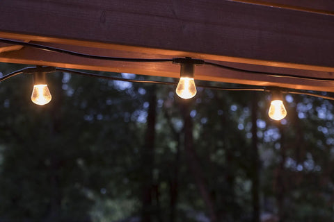 Backyard Bistro Style 24 Foot Outdoor String Lights With 12 Shatter Resistant Lifetime Bulbs, 2200K Warm White glowing outdoors