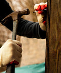 Person using a hammer with Economical String Knit Latex Dipped Palm Gloves With Nitrile Coated Fingers For General Purpose Work