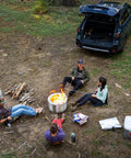 Group camping with open trunk car and campfire, using Go To Outdoor Chair For Stadiums, Camping, And Hiking With All Terrain Comfort