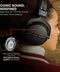 Person wearing DT 770 Pro X Wired Studio Headphones 48 Ohm Closed Back for recording and mixing, side view, black.