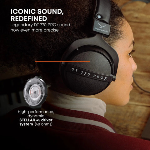 Person wearing DT 770 Pro X Wired Studio Headphones 48 Ohm Closed Back for recording and mixing, side view, black.