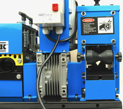 Close-up of WS260 Wire Stripping Machine for Copper Wire Auto Feed and Cut Rollers, showing motor and safety warning label.
