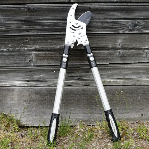 Double Ratcheting Anvil Lopper With Extendable Handles 26 To 40 Inches, lean against wooden shed, rugged rubber grips