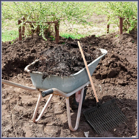6 Piece Manure Fork Replacement Heads Kit With Screws And Nuts 18 Tine Pitchfork Rake next to a wheelbarrow with manure