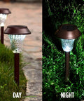 Bronze Solar Path Light Set Of 6 With Glass Lens And Metal Ground Stakes Plus Super Bright LED, daytime and nighttime view in garden.