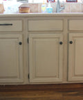 Top Tier Paste Wax For Wood And Cabinet Surfaces With Real Beeswax Blend on aged kitchen cabinets.