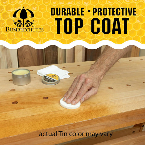 Applying All Purpose Shop Wax Starter Kit with Carnauba Beeswax Paste for Wood Metal Epoxy on a wooden workbench.