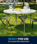 Grab And Go Ready 4 Foot Round Folding Plastic Table With Carrying Handle For Indoor And Outdoor Events displayed outdoors