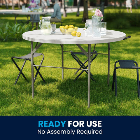 Grab And Go Ready 4 Foot Round Folding Plastic Table With Carrying Handle For Indoor And Outdoor Events displayed outdoors