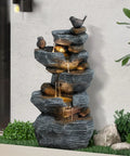 5 Tier Cascading Rock Water Fountain With LED Lights For Outdoor And Indoor Use, displayed in garden setting