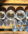 Coin Ring Punch And Spacer Set For Jewelry Making Tools With Self Centering Punch Hole Punch Coin Ring Die Wraps And Swedish Wrap Method includes die and rod set on wood table