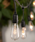 Close-up of lit 24 Pack Edison Style Replacement Bulbs For Outdoor String Lights 7W E17 ST40 Clear Glass Lamps Warm White 2300K