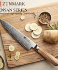 Eight Inch Damascus Steel Chef Knife With A Smooth Olive Wood Handle And Razor Sharp 10Cr15CoMoV Core slicing through vegetables on a wooden board.