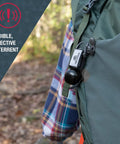 Frontiersman Max Bear Spray Kit With 7.9 Oz Deterrent, bear bell attached to hiking backpack with plaid shirt