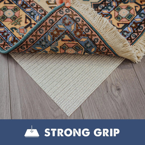 Natural Rubber Rug Grip Non Slip Pad 3 By 5 Inch Low Profile Rug Pad under a decorative rug on hardwood floor.