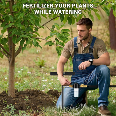 Man using Deep Root Watering Spike For Trees With Fertilizer Bottle Stainless Steel Root Feeder Brass Valve in a garden
