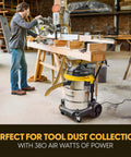 14 Gallon Wet And Dry Shop Vacuum With 65 Peak Horsepower Motor And Stainless Steel Tank Featuring Eighteen Accessories Plus Onboard Storage For Beast Mode Mess Clean Up Projects in a woodshop setup.