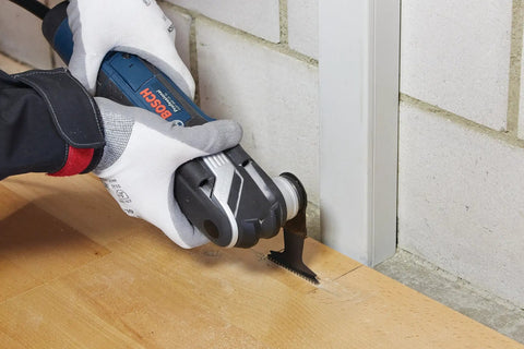 Worker using oscillating tool with 5 Piece Starlock Oscillating Multi Tool Blade Set For Metal Wood And General Materials