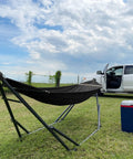 Uniki Hammock Stand With 3 Year Warranty Instant 30 Second Foldable Hammock Setup 550 Lb Capacity on grass by white truck