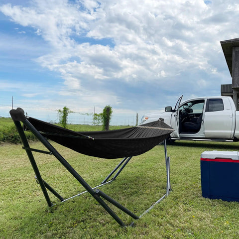 Uniki Hammock Stand With 3 Year Warranty Instant 30 Second Foldable Hammock Setup 550 Lb Capacity on grass by white truck