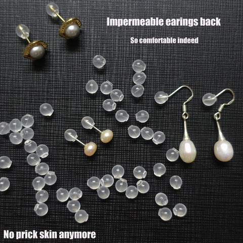 102 Count Comfort Impenetrable Soft Safety Earring Backs Made From TPE Medical-Grade Material Pacifier-Grade, scattered with earrings