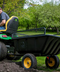 Heavy Duty Lawn And Garden Trailer With 900 Lb Capacity 15 Cu Ft Poly Tub attached to lawn tractor