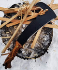 All In One Survival Machete And Brush Axe With Sheath For Camping Fishing Hunting And Bushcraft A Heavy Duty Outdoor Tool Built For Brush Clearing Digging And Trail Work on wooden stump
