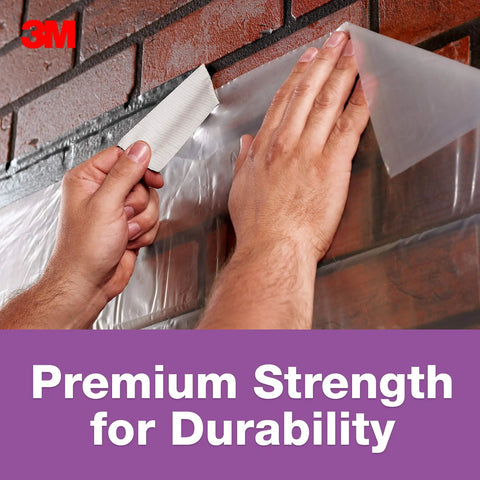Applying No Residue Duct Tape 1.88 Inch By 20 Yards Grey 2420A Heavy Duty Adhesive for quick fixes on a brick wall