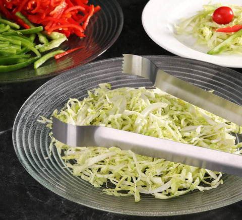 Restaurant Grade 6.5 Inch Pom Tong Set Of 6 Stainless Steel Garnish Tongs with satin finish resting on shredded cabbage dish.