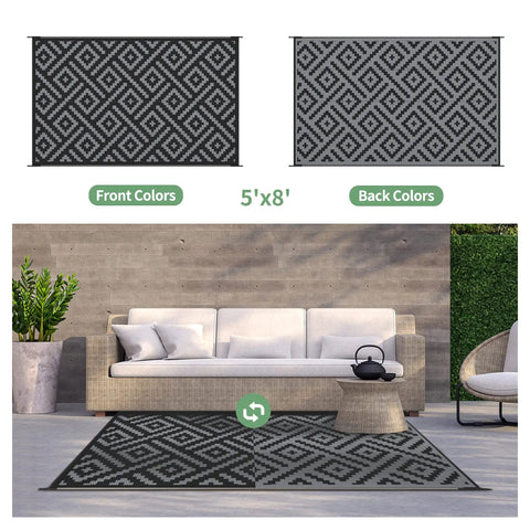 Durable 5x8 Outdoor Rug For Patio And RV Use, Waterproof Reversible Plastic Mat with black and gray geometric design on patio