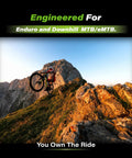 Mountain biker on rocky terrain for graphene compound mountain bike brake pads for SRAM Avid Code R E RSC Guide RE G2 RE DB8 Motive ebike enduro downhill racing quiet smooth braking with grippy bite and long lasting high temperature performance.