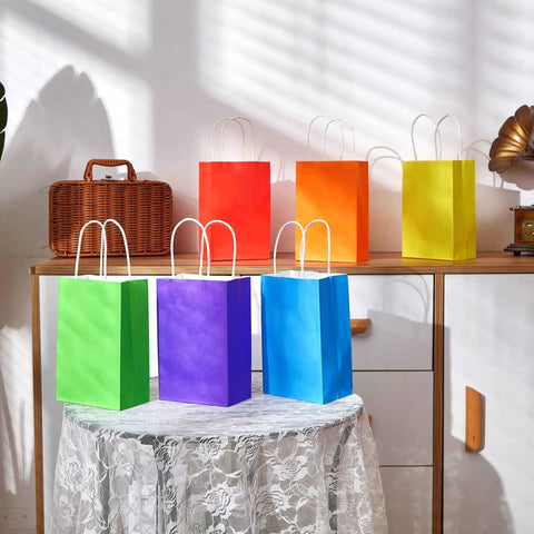 Rainbow Gift Bags With Handles Set 24 Pack 8 Inch Multi Color Paper Party Favor Bags on table and shelf display