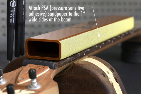 Pro Grade Fret Leveling Kit with 16 Inch Sanding Beam on guitar neck, showing attachment of PSA sandpaper, 25.5 Inch F Scale