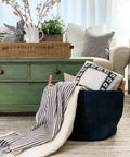 Black Cotton Rope Storage Basket With Real Leather Handles Big 20x13 Inch Blanket And Toy Organizer in living room.