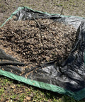 Drawstring 9x9 Tarp For Leaves And Outdoor Use With Cinch Bag Easy Cleanup Heavy Duty Cover Tarp on ground with leaves piled