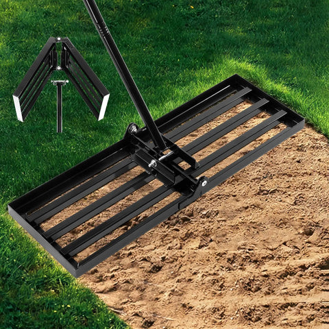 Foldable Lawn Leveling Rake with 72 Inch Adjustable Handle and Detachable Carbon Steel Head on soil in garden