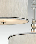 Close-up of Modern 3 Light Kitchen Chandelier in Brushed Nickel With Drum Shade, linen fabric and glass diffuser detail.