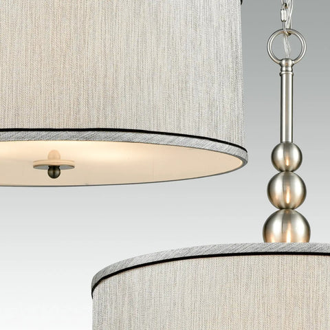 Close-up of Modern 3 Light Kitchen Chandelier in Brushed Nickel With Drum Shade, linen fabric and glass diffuser detail.