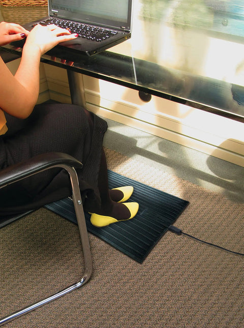 Electric Foot Warmer Mat Portable Heated Rubber Floor Pad for Home Office Garage and Car 120 Watt Personal Space Heater in use under desk