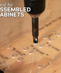 Close-up of Dual Sided Shelf Pin Jig with One Quarter Inch and Five Millimeter Self Centering Drill Bits on cabinet