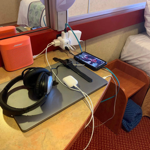 Cruise Approved Non Surge Power Strip With Six Outlets And Three USB Ports And Three AC Sockets in use on cruise desk setup